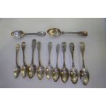 Eleven Georgian silver dessert spoons of various designs and hallmarks. Designs include Thread and S