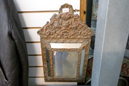 A small bevelled square mirror