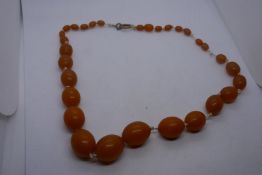 String of graduated butterscotch possibly amber beads