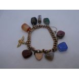 9ct rose gold curb link bracelet hung with 8 various hardstone 'charms' and 9ct RAF charm, with hear