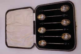 A cased set of six coffee spoons hallmarked Birmingham 1927, Marson and Jones. Also with a set of si