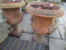 A pair of old Urns terracotta garden decorated animals on square