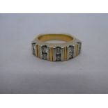 Yellow metal, possibly 18ct yellow gold, band ring inset with 10 approx .10 carat diamonds, unmarked