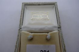 Pair of yellow gold earrings set with white opals, marked 585, in a fitted case