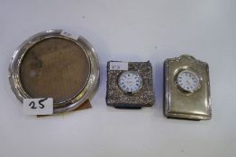 A small decorative silver framed clock. Decorated with repoussé design, hallmarked Sheffield 1995, C