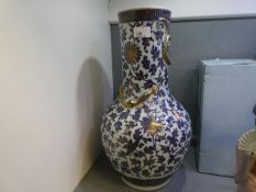 A Chinese vase having blue leaf decoration with gilt highlights, the neck having entwined Dragon 45.