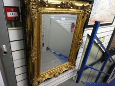 An early 20th century, gilt wall mirror in ebonised outer frame , 76 cm
