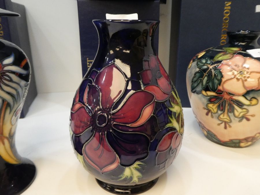 Moorcroft, a floral vase having blue background, 20cm