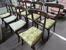 A set of 8 Regency mahogany barback dining chairs having carved decoration on splay legs