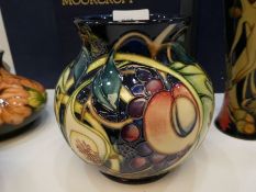 Moorcroft, a Queens choice pattern vase decorated figs and peaches, 14.5cm