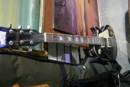 A selection of guitars, electric, etc