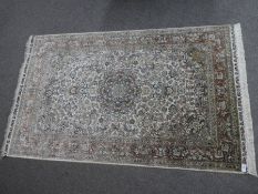 A part silk rug having central spandrel with all over floral decoration153 x 95cm