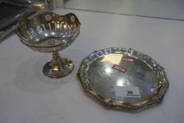 A small circular silver tray with beaded edge hallmarked Birmingham 1904 Wililam Aitken, with a silv