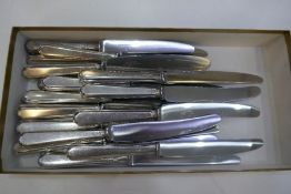 A quantity of twelve large silver handled knives by Walker and Hall, and eleven other silver handled