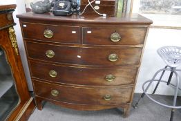 A 19th century mahogany bow front chest having 2 short and 3 long drawers