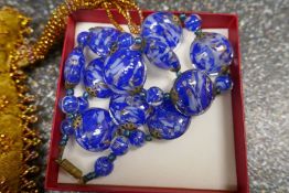 Italian blue glass necklace and an unusual green hardstone example