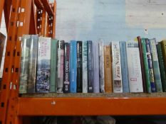 Three shelves of hardback books on Africa, Cricket, the Fall of the Roman Empire, etc