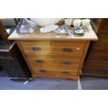 An early 20th century, satin beech dressing chest having three long drawers