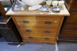 An early 20th century, satin beech dressing chest having three long drawers