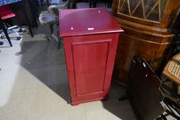 Vintage beech revolving captains chair and a red painted gramophone cabinet