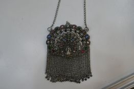 A very pretty middle Eastern white metal purse with decorative coloured stones and peacock design. V