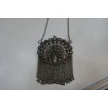 A very pretty middle Eastern white metal purse with decorative coloured stones and peacock design. V