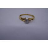 18ct yellow gold solitaire diamond ring, the shoulders set with diamonds, marked 750, size size O, 2