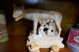 A large resin figure of a wolf with two smaller figures, one a Dog of Fo and one a tortoise
