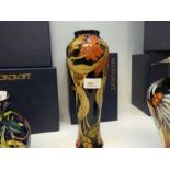 Moorcroft, a limited edition vase, 106/150, decorated with ladies having acorn heads and oak leaves,