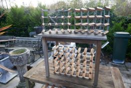 Four wooden and metal wine racks