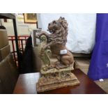 An old cast iron doorstop of seated lion