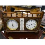 An early 20th century, clock barometer and thermometer set in carved wooden case with balustrade