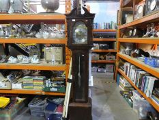 A reproduction Oak long case clock having a glazed door