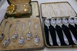 A set of six 1935 silver teaspoons, another set of six 1940 silver teaspoons, and a set of six sterl