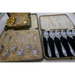 A set of six 1935 silver teaspoons, another set of six 1940 silver teaspoons, and a set of six sterl