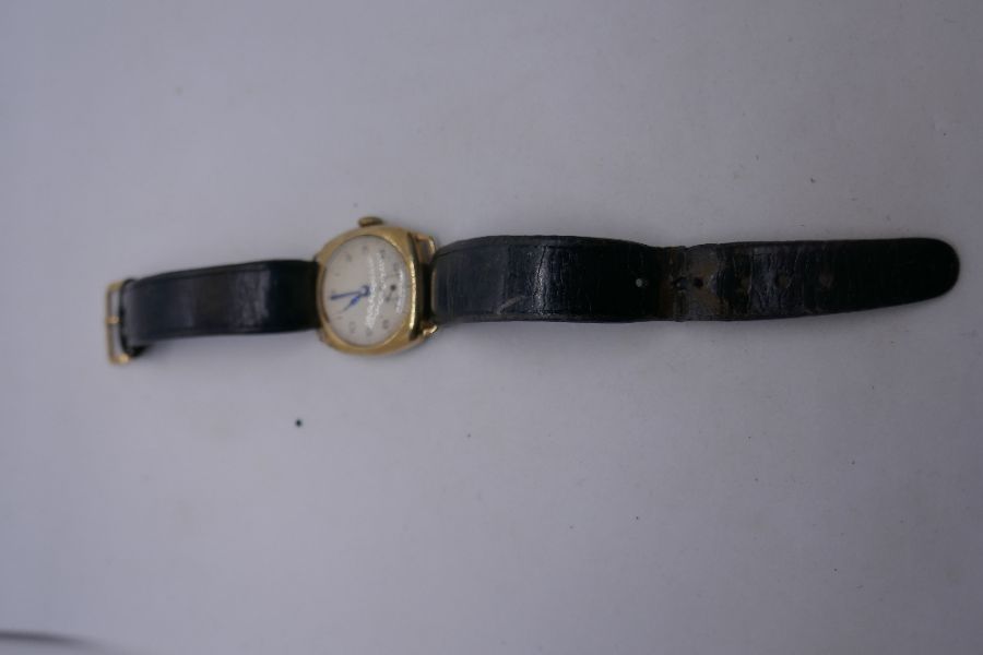 Vintage gents gold cased watch with champagne dial on black leather strap - Image 4 of 6