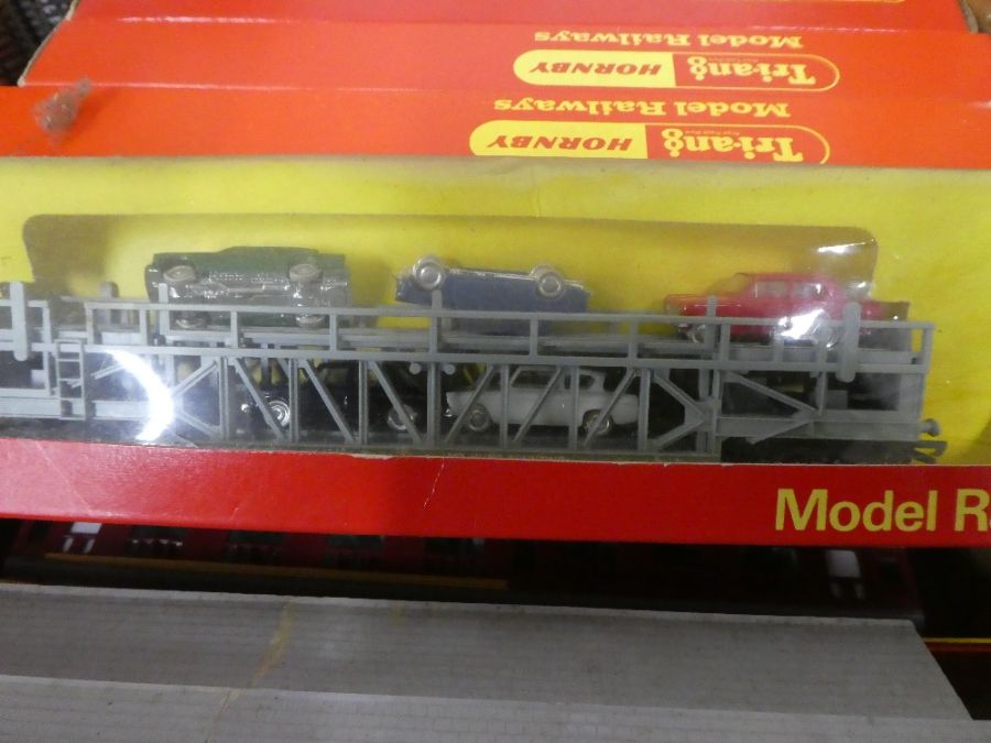 A large quantity of OO gauge boxed rolling stock, control unit and other related accessories and tra - Image 9 of 11