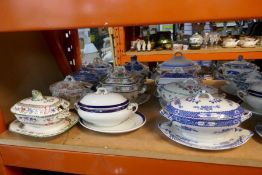A shelf full of small tureens, plus a box of ladel spoons