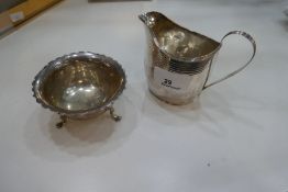 A Georgian silver milk jug, hallmarked London 1799 possibly Crispin Fuller, nice item with engraved