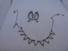 Silver necklace hung with 9 pear shaped moonstones and a pair of silver and moonstone drop earrings,