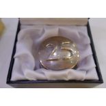 A large Sterling silver cased paperweight with '25' on the top, on low relief. Hallmarked London wit