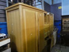 A contemporary oak two door wardrobe with 1 long drawer below