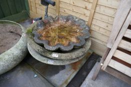 Pair of circular stone effect garden planters and a scallop edge bird bath top