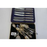 A set of six silver handled knives, cased Yates Brothers, Sheffield 1927, and various silver spoons