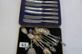 A set of six silver handled knives, cased Yates Brothers, Sheffield 1927, and various silver spoons