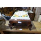 A pair of rosewood footstools with tapestry corners