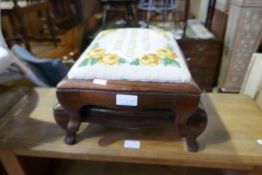 A pair of rosewood footstools with tapestry corners