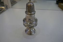 A stunning Victorian silver sugar sifter, very ornate and decorative. With beaded borders, ebonised