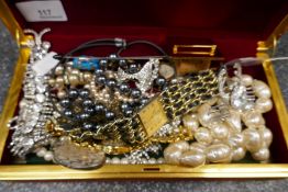 Box of costume jewellery to include brooches, amber and pearl gold clasp necklace, jade pendant, etc