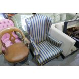 A wing armchair having stripped upholstery and a button back tub chair